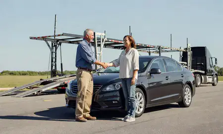 Vehicle owner beside their delivered car in Mauldin, South Carolina, United States