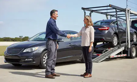 Vehicle owner beside their delivered car in North Charleston, South Carolina, United States