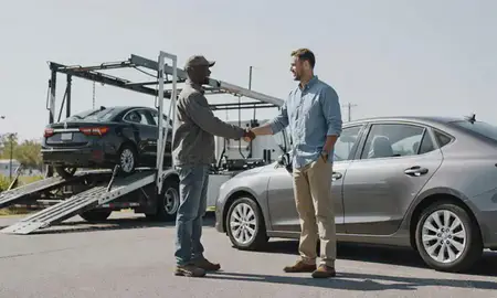 Vehicle owner beside their delivered car in Socastee, South Carolina, United States