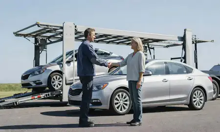 Vehicle owner beside their delivered car in St. Andrews, South Carolina, United States