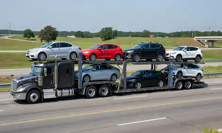 Multi-level car carrier on the highway to Wade Hampton, South Carolina, United States