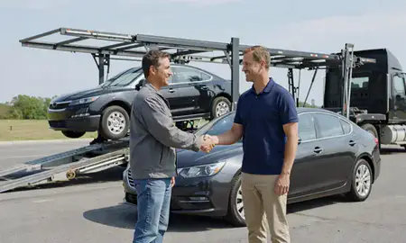 Vehicle owner beside their delivered car in Wade Hampton, South Carolina, United States