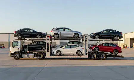 Car transporter parked in an industrial area of Wade Hampton, South Carolina, United States