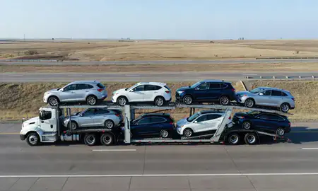 Multi-level car carrier on the highway to Aberdeen, South Dakota, United States
