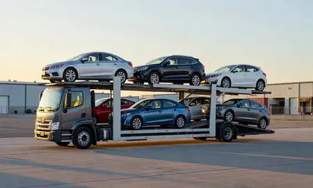 Car transporter loaded with vehicles in Aberdeen, South Dakota, United States