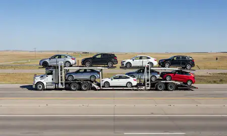 Multi-level car carrier on the highway to Brookings, South Dakota, United States