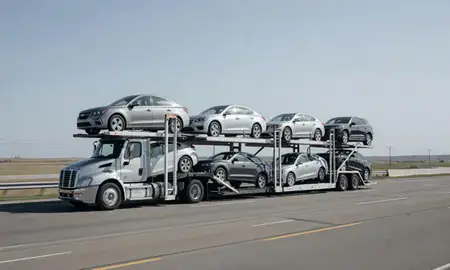 Multi-level car carrier on the highway to Dakota Dunes, South Dakota, United States