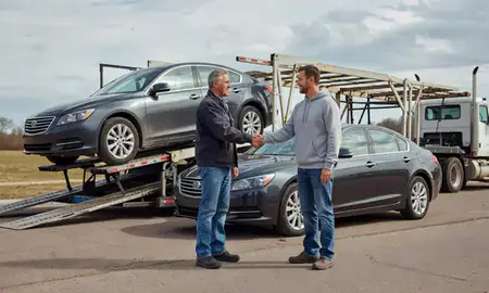 Vehicle owner beside their delivered car in Dell Rapids, South Dakota, United States