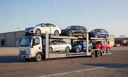 Car transporter loaded with vehicles in Madison, South Dakota, United States