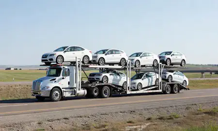 Multi-level car carrier on the highway to Mobridge, South Dakota, United States