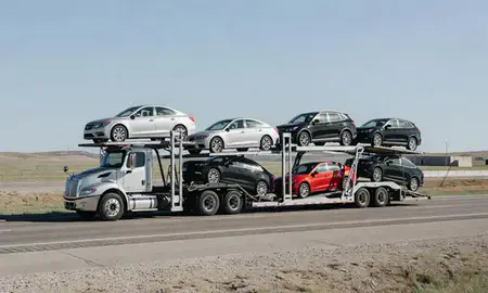 Multi-level car carrier on the highway to North Sioux City, South Dakota, United States