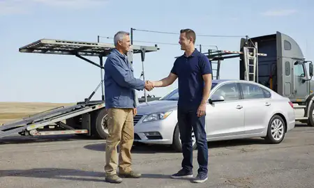Vehicle owner beside their delivered car in Pierre, South Dakota, United States