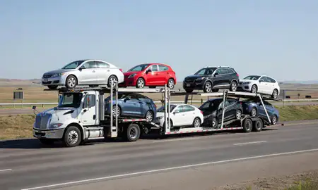 Multi-level car carrier on the highway to Rapid City, South Dakota, United States