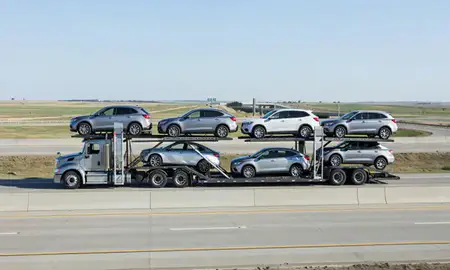 Multi-level car carrier on the highway to Sioux Falls, South Dakota, United States