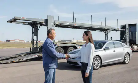 Vehicle owner beside their delivered car in Sioux Falls, South Dakota, United States