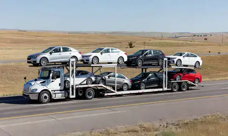 Multi-level car carrier on the highway to Spearfish, South Dakota, United States