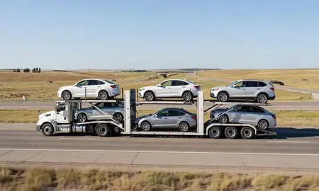 Multi-level car carrier on the highway to Sturgis, South Dakota, United States