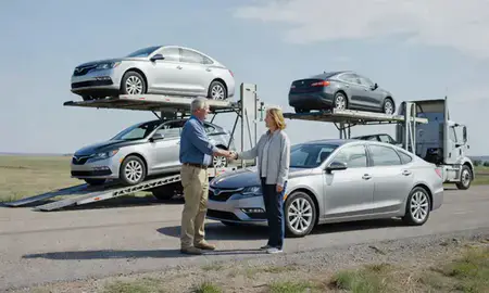 Vehicle owner beside their delivered car in Summerset, South Dakota, United States