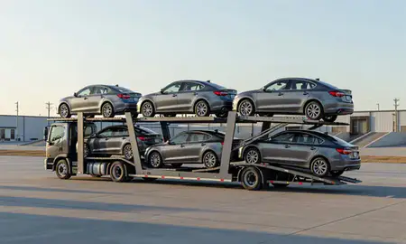 Car transporter loaded with vehicles in Tea, South Dakota, United States
