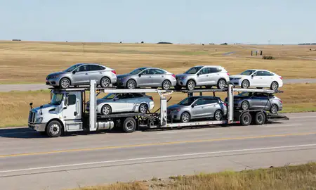 Multi-level car carrier on the highway to Yankton, South Dakota, United States