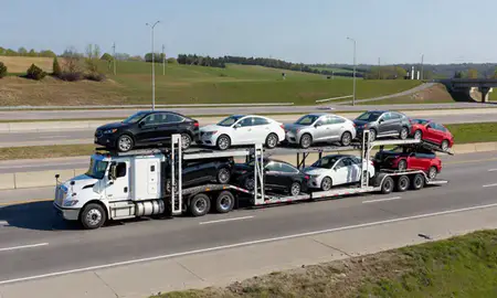 Multi-level car carrier on the highway to Cleveland, Tennessee, United States