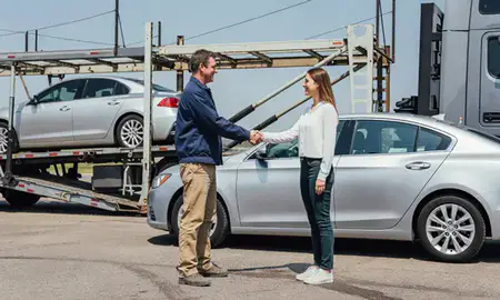 Vehicle owner beside their delivered car in Cookeville, Tennessee, United States