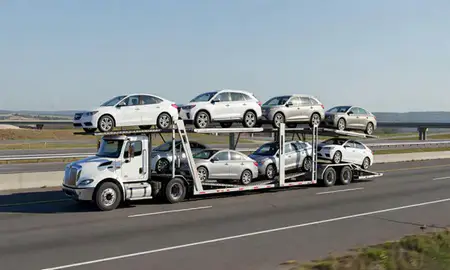 Multi-level car carrier on the highway to Jackson, Tennessee, United States