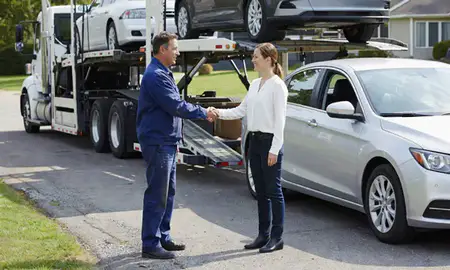 Vehicle owner beside their delivered car in Knoxville, Tennessee, United States