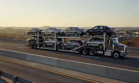 Car transporter with the Mount Juliet, Tennessee, United States skyline behind it