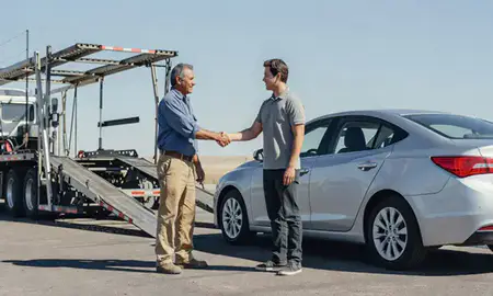 Vehicle owner beside their delivered car in Amarillo, Texas, United States