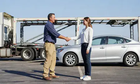 Vehicle owner beside their delivered car in Brownsville, Texas, United States