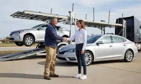 Vehicle owner beside their delivered car in College Station, Texas, United States
