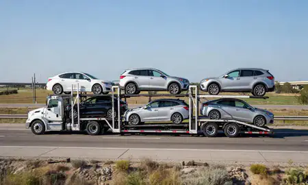 Multi-level car carrier on the highway to Corpus Christi, Texas, United States
