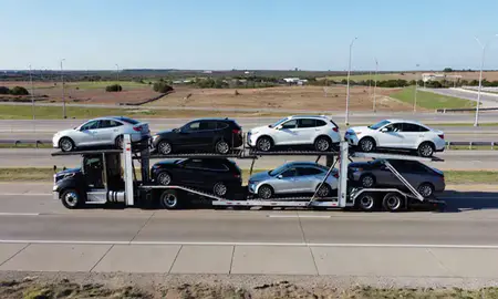Multi-level car carrier on the highway to Denton, Texas, United States