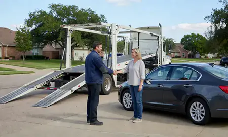 Vehicle owner beside their delivered car in Denton, Texas, United States