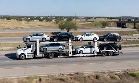 Multi-level car carrier on the highway to Fort Worth, Texas, United States