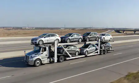 Multi-level car carrier on the highway to Frisco, Texas, United States