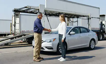Vehicle owner beside their delivered car in Galveston, Texas, United States