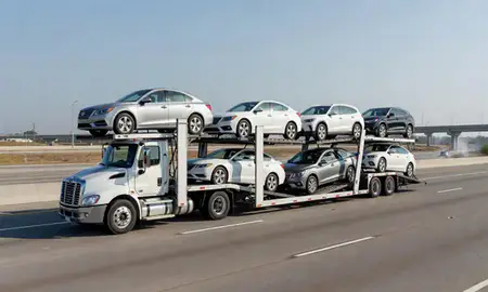 Multi-level car carrier on the highway to Houston, Texas, United States