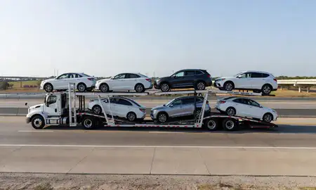 Multi-level car carrier on the highway to Irving, Texas, United States