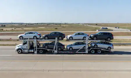 Multi-level car carrier on the highway to Lubbock, Texas, United States