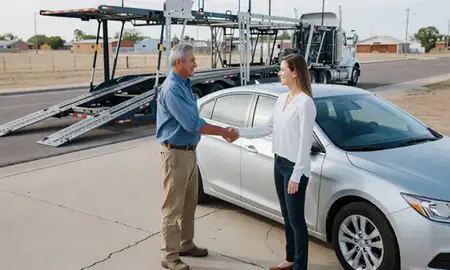 Vehicle owner beside their delivered car in Lubbock, Texas, United States