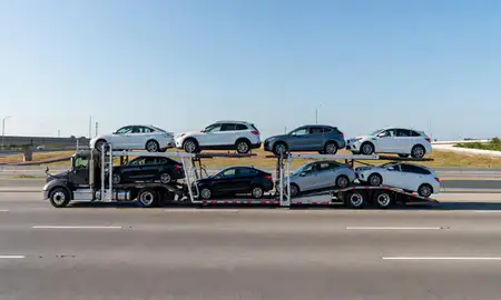 Multi-level car carrier on the highway to McKinney, Texas, United States