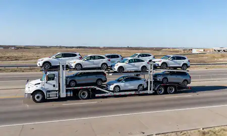 Multi-level car carrier on the highway to Midland, Texas, United States