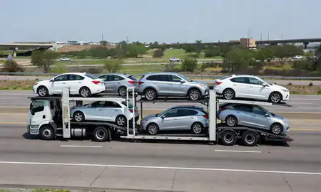 Multi-level car carrier on the highway to Pasadena, Texas, United States