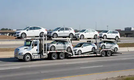 Multi-level car carrier on the highway to Plano, Texas, United States