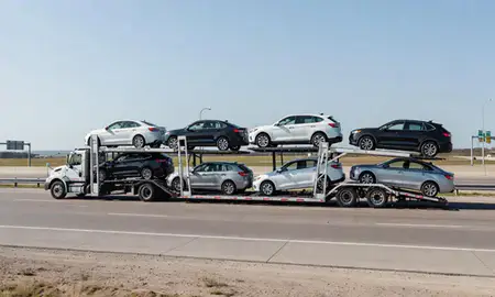 Multi-level car carrier on the highway to Waco, Texas, United States
