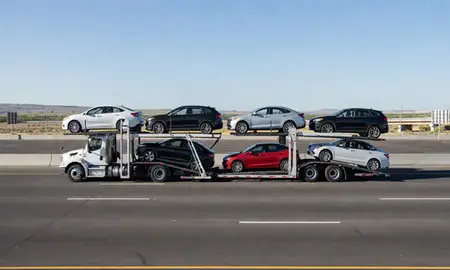 Multi-level car carrier on the highway to Bountiful, Utah, United States