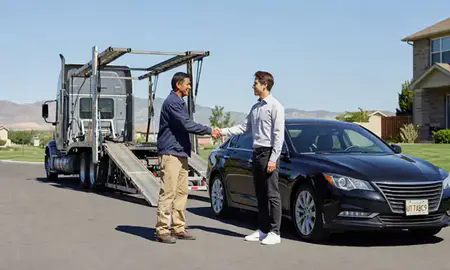 Vehicle owner beside their delivered car in Draper, Utah, United States