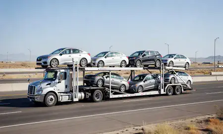 Multi-level car carrier on the highway to Layton, Utah, United States